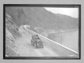 [auto tour near river, railroad tracks]