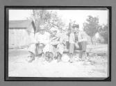 [three men sitting]