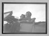 [close-up of man and woman in auto]