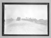 [auto approaching bridge]