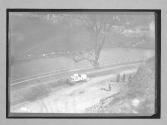 [auto driving past Ottawa River]