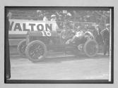 [auto race "#18" parked]