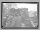 [three men packing auto]
