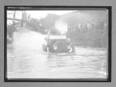 [auto tour crossing river]