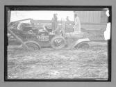 [auto tour "Premier Official" stuck in mud]