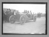 [auto racer in auto at track]