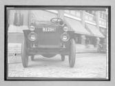 [close-up of auto with NY plates "M1294"]