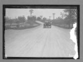 [auto tour driving on country road]