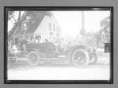 [people in auto in town]