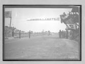 [auto race "#6" crossing finish line]