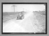 [auto racing on country road "#76"]