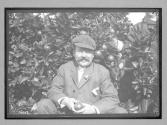 [portrait of man in garden]