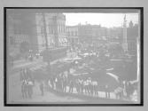 [auto race on town street, trolley]