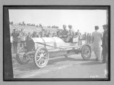 [auto racers in auto at track]