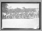[autos lined up "Moline #100, #101, #102"]