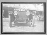 [close-up of front auto NY plates "M1294"]