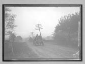 [auto driving on country road]