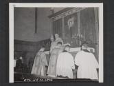 [Chaplain L. Curtis Tiernen, Ft. Leavenworth Kan., giving the benediction to men of an infantry division who attended a catholic mission held for them by the HQ.]