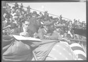 [auto race spectators in stands]