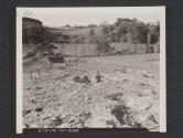 [Mine field used for training purposes during regimental maneuvers in England. A soldier stands in the crater left by a mine which has been exploded. 7th Engr Regt, 5th Inf Div, Blackpool Sands, Devon, England.]