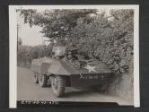 [M8 Armoured scout car stopped by side of road during tactical exerises somewhere in England.]