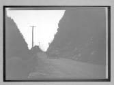 [auto on country road]
