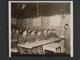 [W.O (JG) Floyd W. Thompson, Atlanta, GA., instructs a class in message center procedure at a division signal school in United Kingdom. 5th Inf Div., Newcastle, County Down, No. Ireland.]