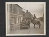 [Sgt. William R. O'Toole, Chicago, Ill., French book in hand, asks directions of a French milk maid near Cerisey La Foret. Sgt Merritt McClain, Ashland, Ohio, is on his right and Cpl Gordon Crothers, Hastings, Mich., in rear seat. 5th Signal Co, 5th Inf Div.]