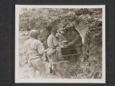 [S/Sgt Ray Liedke, Forest Park, ILL., Mess Sgt of a signal co. feeds his men seome juicy steaks before going out to the front line troops. Near Cerisey La Foret, France.  5th Sig. Co.]