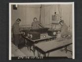 [Signal school in United Kingdom. SGT Walter Lecznar, Detroit, MICH., left, S/SGT Reuben Anderson, Princeton, ILL., and SGT Frank Howard, Johnstown, PA., operating automatic keyers.  5th Inf Div., Newcastle, County Down, No. Ireland.]