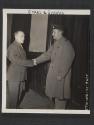 [M/Sgt. Theron C. Bollinger, Battle Creek, MICH.,  greets Lt. Burns C. Cox, Atlanta, GA. with whom he served during World War I and with whom he is now serving.  5th Inf Div., Newcastle, County Down, No. Ireland.]