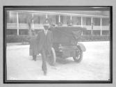 [people in front of hotel or race track building]
