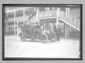 [people in front of hotel or race track building]