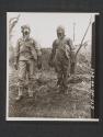 [Gas school in Northern Ireland. Types of impregnated clothing, Impregnated fatigues on left, and impregnated suit on right. 5th Inf Div, Seaforde, Co. Down. No. Ire.]