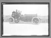 [auto racers parked on road]