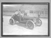 [auto racers at track]