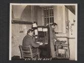 [View of switchboard at a unit headquarters in Northern Ireland. T/4 Norman Howell, Stanton, MICH., Chief operator, and PFC Lewis La Vake, Detroit, MICH., at the board and making a test, respectively.  5th Sig Co., 5th Inf Div, Braynsford, County Down, Northern Ireland. ]