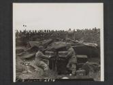 [T/3 Gilbert Ninneman, Cascade, Wisc., and T/5 Robert Ryan, Chicago, Wisc., adjusting the controls of the PA system their signal co., installed for use at an artillery demonstration.  5th Sig. Co., 5th Inf. Div., near Annalong, County Down, Northern Ireland.]