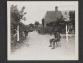 [Pfc. Paul Burkebile, of Hershey, PA., walkie-talkie operator with an infantry unit, catches a brief rest while he works, during an advance on the fighting front in France. St Ouen des Besaces, France.]
