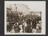 [Five Germans, captured by Americans mopping up in Cherre, France, move in a truck between other truck loaded with American troops.]