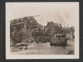 [An American tank fords a stream in the Fountainbleau section of France in the drive which routed the Germans from the area. American engineers are repairing a bridge over the stream.]
