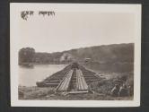 [The first tank rolls across a newly constructed pontoon  bridge across the Seine River. The Bridge was built by US Army Engineers to replace one that was destroyed during the action around the town of Vulaines-Sur-Seine, France.]