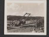 [The final section of treadway is laid into placeon a newly constructed pontoon bridge across the Seine River. The bridge is being built by the US Army Engineers to replace one destroyed during the action around the town of Vulaines-Sur-Seine, France.]