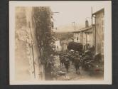 [U.S. troops are shown marching down street in town of Dornet, France, while advancing on the Mozelle river in France.]