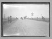 [autos racing on country road]