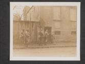 [U.S. Infantry troops of the 10th Regt., 5th Infantry Division, break down the front door on this house in Metz France, to clear the place of any enemy stragglers who may be in hiding.   [typed but crossed out: 44-20304 19 Nov  Members of the 10th Infantry Regt., 5th Infantry Div. Fire back at the unseen ememy from behind this wall where they were pinned down by German 20mm gun fire.]]