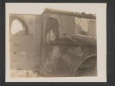 [German bullet mark on American (clearly marked) ambulance. According to eye witnesses, German pilotted [sic] P47's straffed [sic] this ambulance as it carried patients in Luxembourg. Driver and patients were killed.  5th Inf Div 5th Med BN., Gonderange, Luxembourg.]