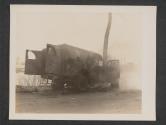 [American ambulance, just after it was straffed [sic] by (according to eye witnesses) German pilotted [sic] P 47's. It was plainly marked and the weather was clear. Driver and patients were killed.  5th Med BN 5th Inf Div., Gonderange, Luxembourg.]