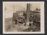 [Plainly marked American ambulance, just after it was straffed [sic] by (according to eye witnesses) German pilotted [sic] P 47's. Driver and patients were killed.  5th Med Div., 5th Inf., Div., Gonderange, Luxembourg]