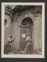 [5th Division Infantryman, left, Sgt. Alfred Brueggeman, of St. Louis, MO., reads sign left by Nazis to Sgt. John W. McCoy, of Bunola, PA. Sign prohibits Nazi soldiers from attending services on Friday and Sunday.  5th Inf Div TUSA]